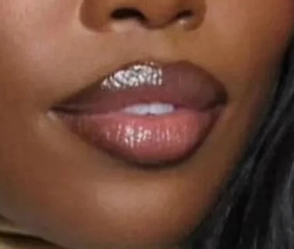 Lips wearing the Berry Crush lip combo: a cocoa liner with a glossy, nude-brown center