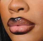 Lips wearing the Pink Bliss lip combo: an espresso liner framing a soft, glossy pink center